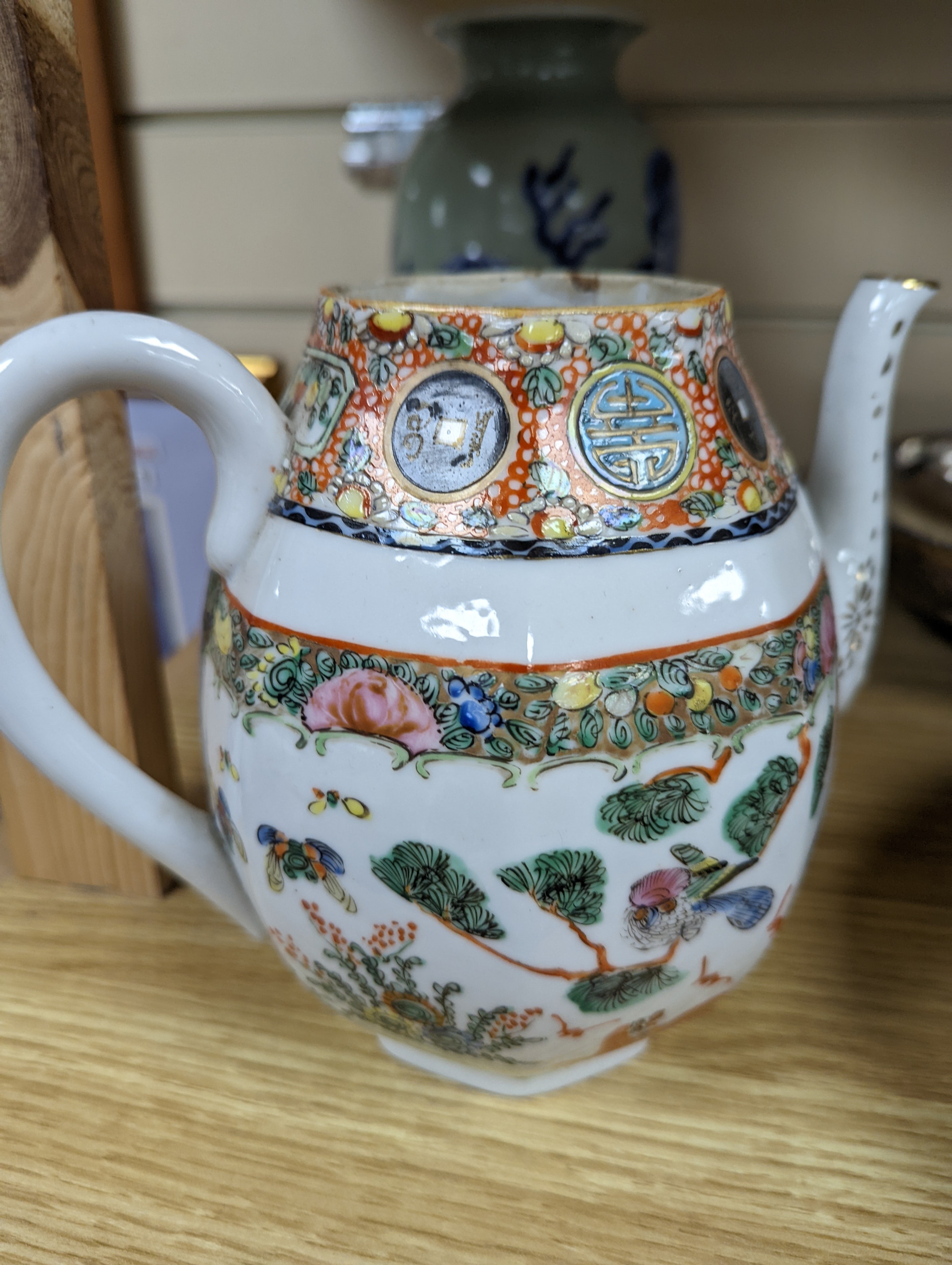 A Chinese celadon glazed vase, 24cm and a Chinese famille rose teapot and matching cream jug, a.f.